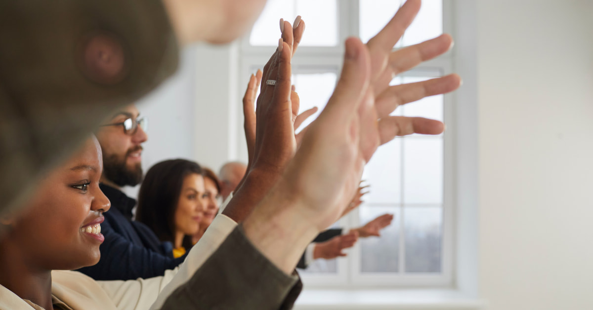 Volunteers Raising Hands