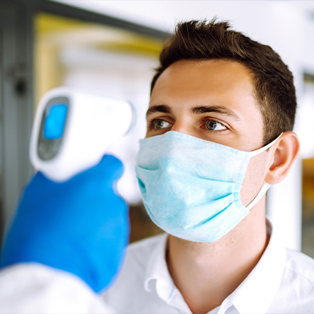 man getting temp checked